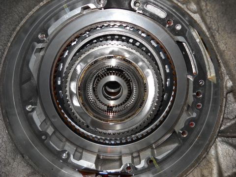 1993 Ford C-150 (Centurion Conversions) - Internal components of an automatic transmission, showing multiple layers of gears and clutch plates.
