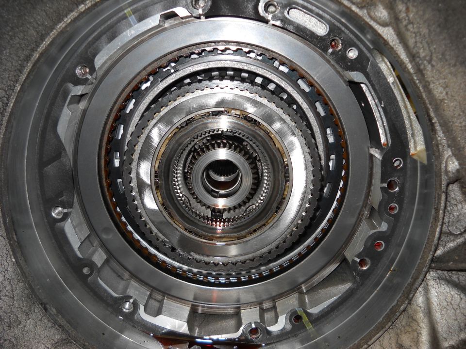 Close-up of stacked gears and clutch packs inside an automatic transmission