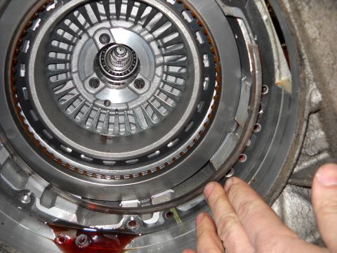 1993 Ford C-150 (Centurion Conversions) - Close-up view of an automatic transmission torque converter, with red fluid visible at the bottom.