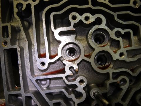 1993 Ford C-150 (Centurion Conversions) - This is a close-up view of an automatic transmission valve body, showing its complex internal passages.