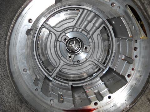 1993 Ford C-150 (Centurion Conversions) - The internal components of an automatic transmission torque converter are visible in this close-up shot.