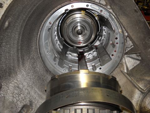 1993 Ford C-150 (Centurion Conversions) - Close-up view of the internal components of a transmission, showing signs of wear and residual fluid.