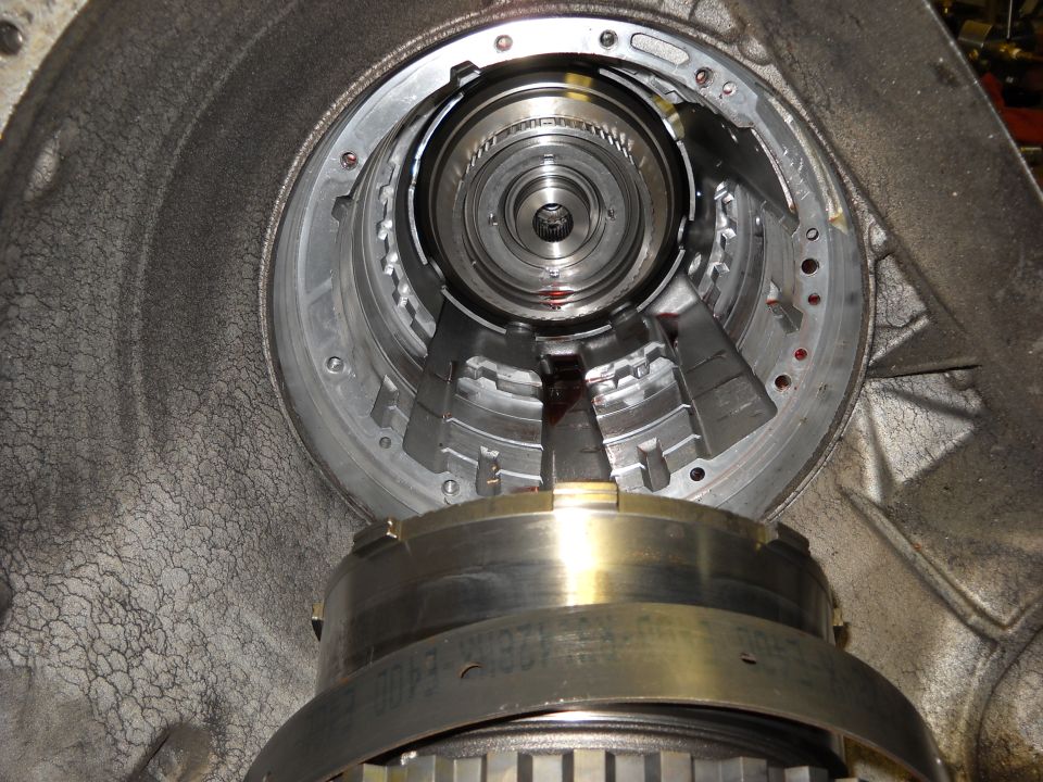 Transmission internals with visible wear and fluid