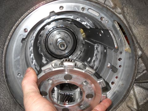 1993 Ford C-150 (Centurion Conversions) - Close-up view of internal transmission components during a rebuild.