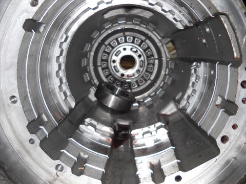 1993 Ford C-150 (Centurion Conversions) - Close-up view of the internal components of a disassembled automatic transmission torque converter housing.