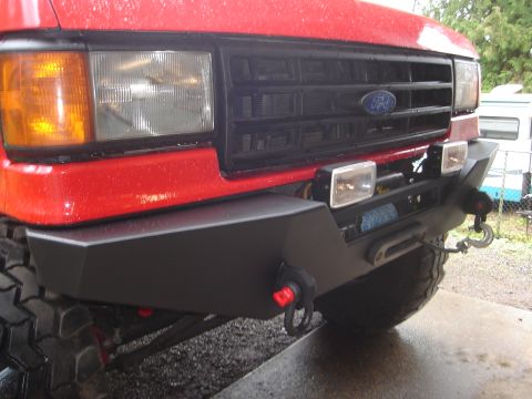 1989 Ford Bronco - Front view of a 1989 Ford Bronco a custom bumper with winch and tow hooks.