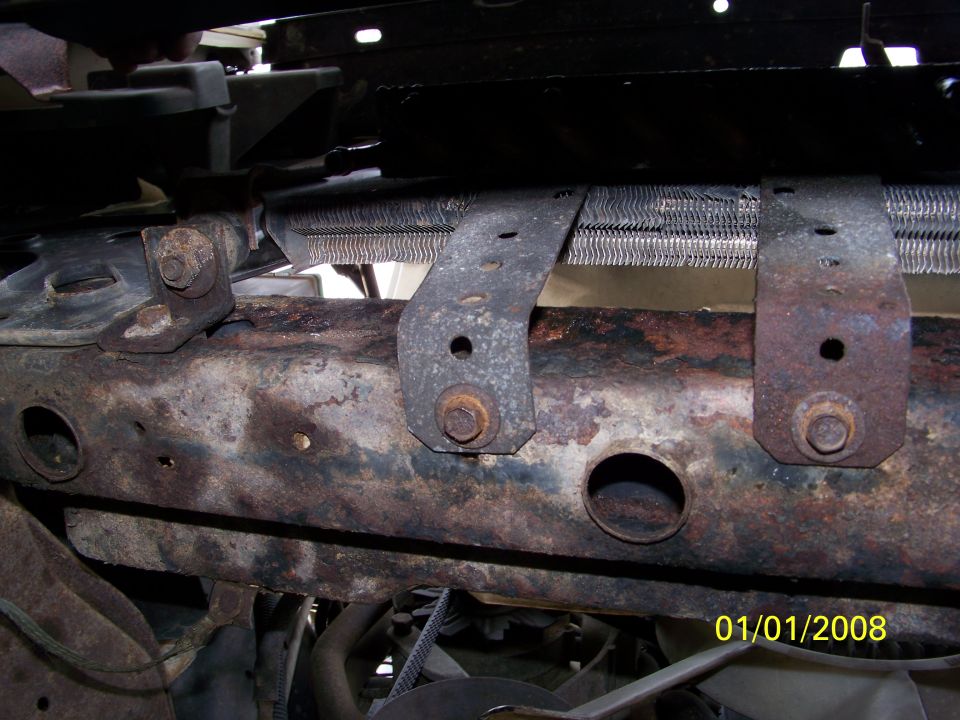 rusted vehicle frame with radiator and mounting brackets. Date stamp reads 01/01/2008