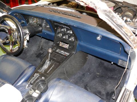 1976 Chevrolet Corvette - Interior view of a 1976 Chevrolet Corvette, showing the dashboard, steering wheel, and center console.
