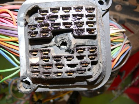 1976 Chevrolet Corvette - This image shows a close-up view of a complex electrical connector with numerous wires, likely from a vehicle's wiring harness.
