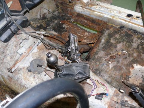 1976 Chevrolet Corvette - Severe rust has compromised the interior floor pan of this vehicle, affecting the shifter mechanism.