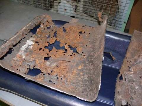 1976 Chevrolet Corvette - These metal parts are heavily corroded and show significant deterioration.