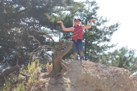 1989 Ford Bronco - Child stands on a dirt mound with trees in the background.