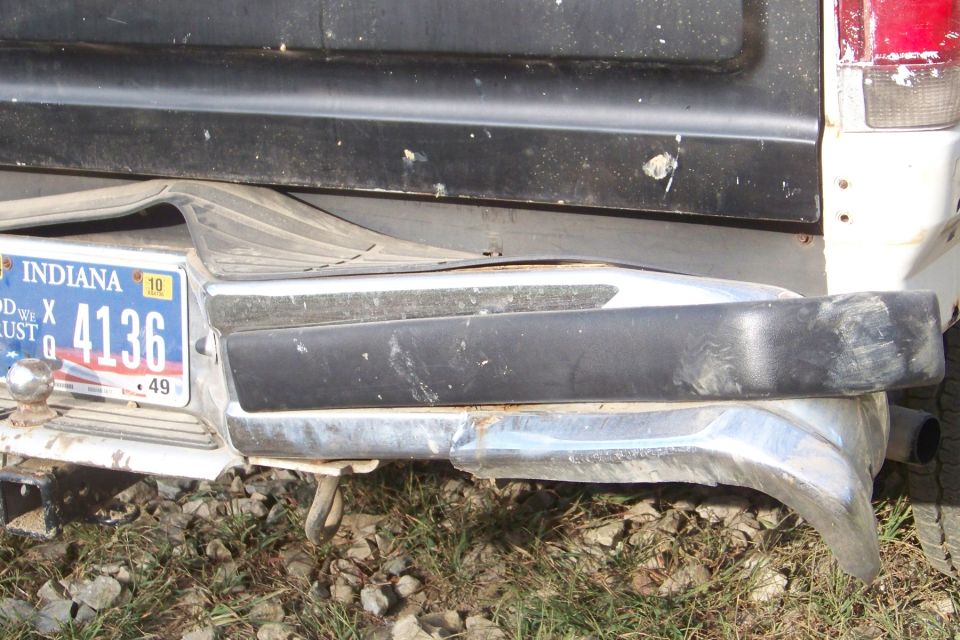 Rear bumper and Indiana license plate 4136 on a damaged truck
