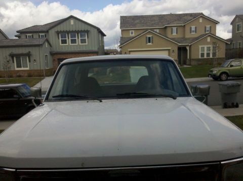 1995 Ford Bronco - Front view of a 1995 Ford Bronco parked in a suburban driveway.