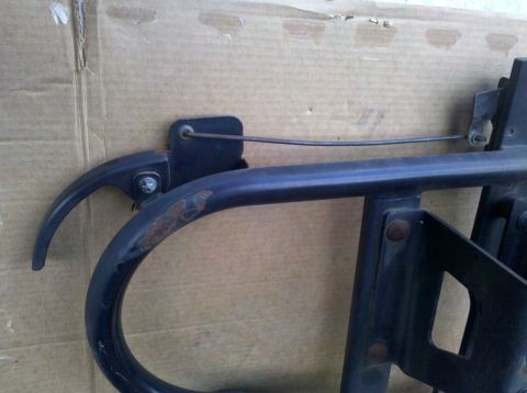 1995 Ford Bronco - A close-up view of a vehicle part, showing some rust and a connected cable.