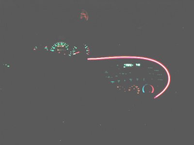 1997 Ford Taurus - Illuminated dashboard of a 1997 Ford Taurus at night, showing gauges and radio.