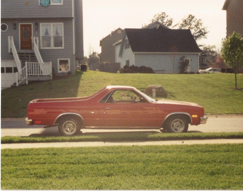 Red 1979 Chevrolet El Camino parked on street, side view