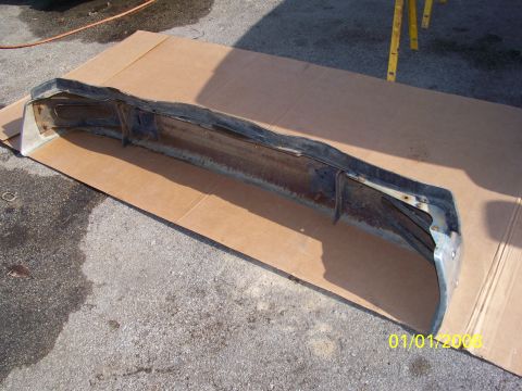 1989 Ford Bronco - This is a used bumper for a Ford Bronco, shown on cardboard.