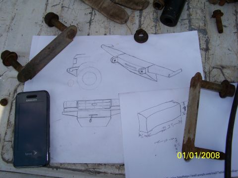1989 Ford Bronco - Photo of hand-drawn part sketches lying on a workbench, not a clean technical document.