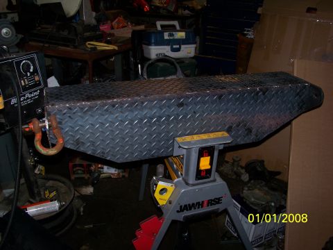 1989 Ford Bronco - Diamond plate toolbox supported by a JAWHORSE stand in a workshop setting.