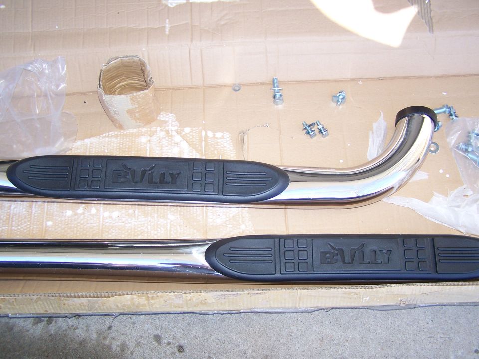 Bully brand running boards in a cardboard box with hardware
