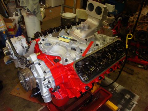 1989 Ford Bronco - A rebuilt V8 engine sits on a stand, ready for installation.