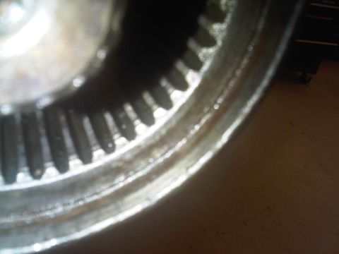 1978 Ford Bronco - Close-up of a metal gear with many teeth, possibly from a transmission or differential.