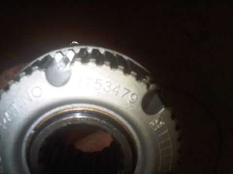 1978 Ford Bronco - A close-up view of a vehicle part shows stamped numbers and a toothed edge.
