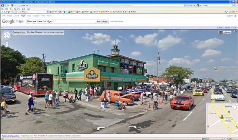 1971 Ford Ranchero - A street view captures a lively scene outside Duggan's Irish Pub, with numerous cars and pedestrians present.