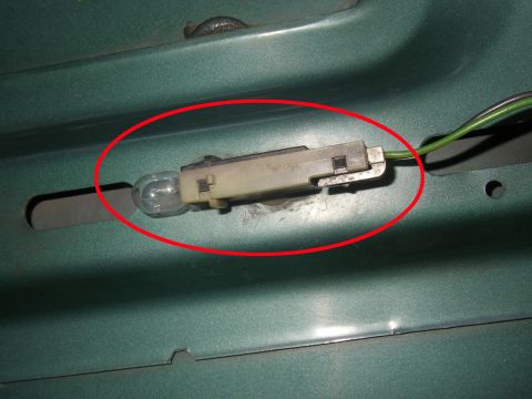 1990 Ford Bronco - Interior light bulb socket shown in detail, part of a vehicle's internal lighting system.