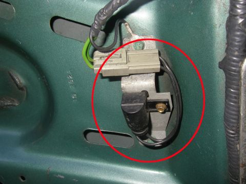1990 Ford Bronco - A red circle draws attention to a vehicle's electrical sensor and its wiring harness.