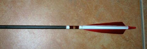 1993 Ford Bronco - An arrow with red fletching, a white shaft, and decorative bands is shown against a tiled background.