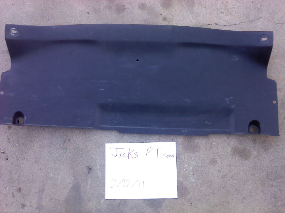 Dark plastic undertray panel with mounting holes