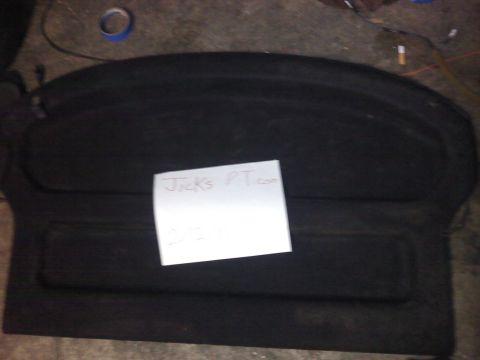 1995 Ford Probe - A black trunk liner is shown with a handwritten note placed on it.