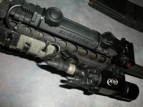 1996 Ford Bronco - Weapon accessory rail with Surefire and X300 Ultra lights mounted.