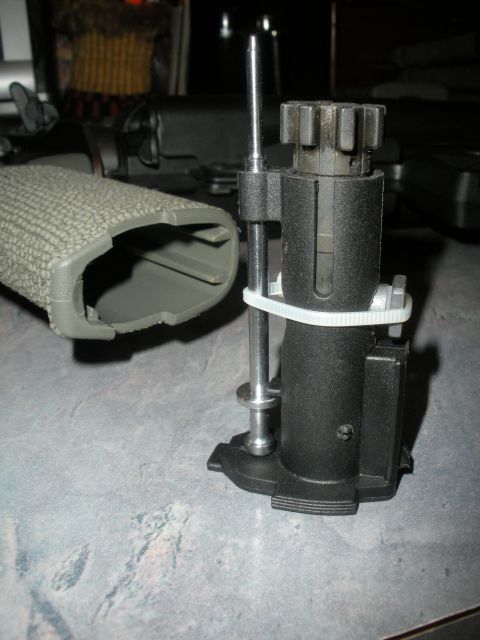 1996 Ford Bronco - Close-up view of a firearm bolt carrier group and a textured grip, with a "Supermotors.net" watermark at the bottom.