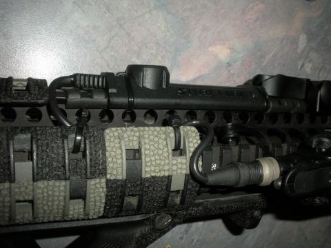 1996 Ford Bronco - Tactical rifle rail system with attached accessories and grip panels.