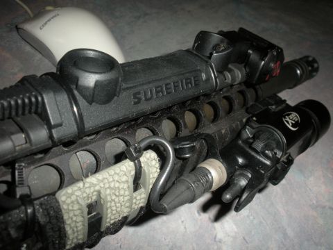 1996 Ford Bronco - Tactical rifle accessories, including a Surefire light, are mounted to a rail system.