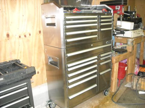 1979 Ford F-150 - A workshop scene a large stainless steel tool chest and a drill press on a wooden workbench.