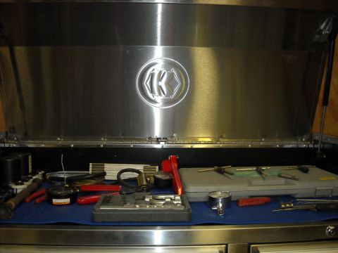 1979 Ford F-150 - A collection of tools, including pliers, taps, and a measuring gauge, are organized inside an open toolbox.