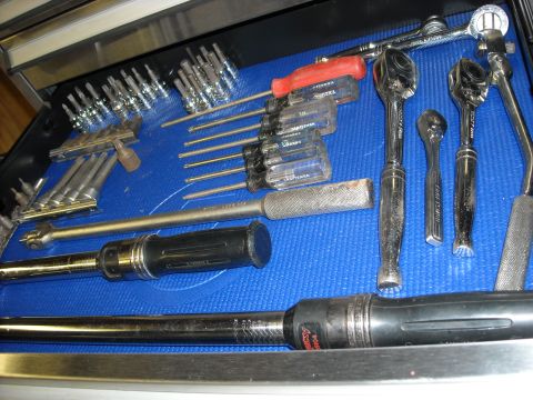 1979 Ford F-150 - A collection of hand tools, including screwdrivers and ratchets, neatly organized in a tool drawer.