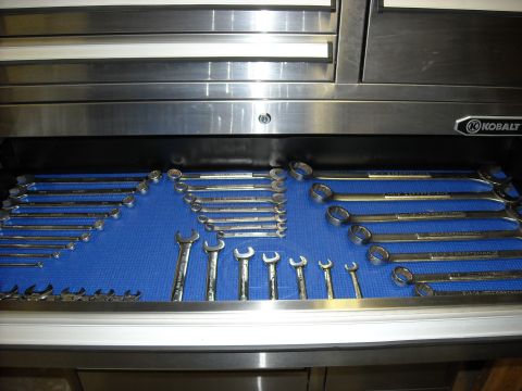 1979 Ford F-150 - A Kobalt tool drawer filled with a variety of wrenches organized on a blue mat.