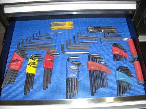 1979 Ford F-150 - A collection of hex keys, including sets from brands like Husky, ChESCO, and Klein Tools, are neatly arranged in a blue-lined drawer.