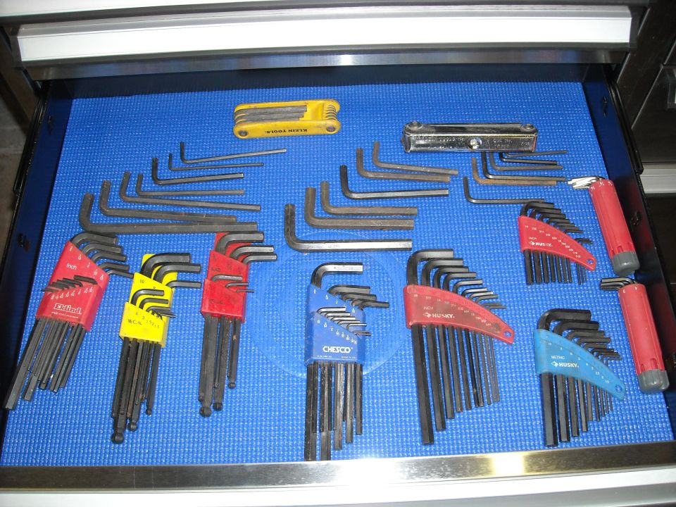 Tool drawer with various hex keys organized by color and size