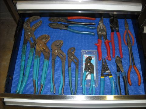 1979 Ford F-150 - Various hand tools including pliers, cutters, and wire strippers are neatly organized in a tool drawer.