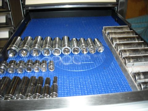 1979 Ford F-150 - A collection of chrome sockets and extensions are organized within a toolbox drawer on a blue mat.