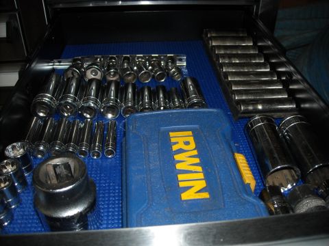 1979 Ford F-150 - A collection of sockets and a socket case are neatly organized in a toolbox drawer.