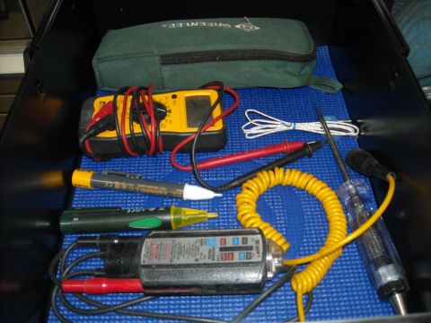 1979 Ford F-150 - A collection of electrical testing tools is organized within an open case.