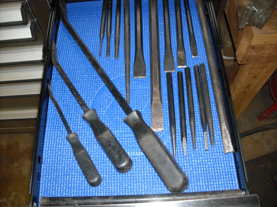 Pry bars and punches in a tool drawer