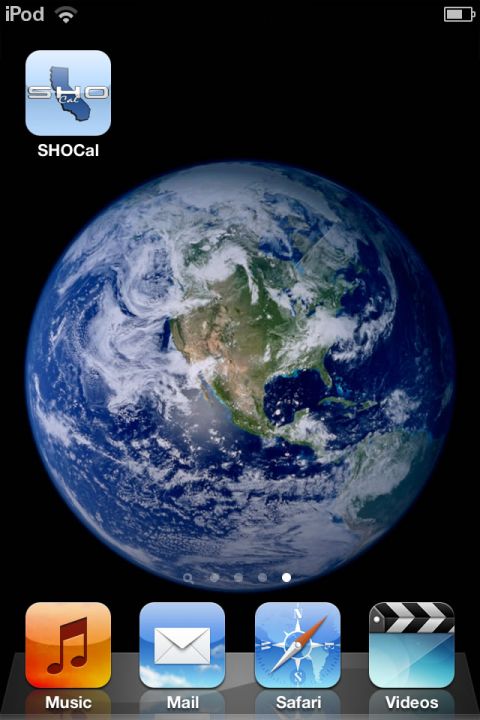 1993 Ford Taurus - An iPhone home screen displays an Earth wallpaper and various app icons, including one for SHO Cal.